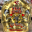 Gold fire helmet shield reads "Fire Chief / UC Davis / Trauernicht"
