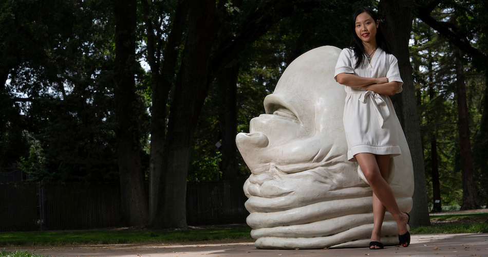 Recent graduate, Daisy He photographed at the "Eye on Mrak" egghead near Mrak Hall. He is a former Student Assistant to the Chancellor. She is an international student from China who majored in Psychology and Econmics. (Karin Higgins/UC Davis)