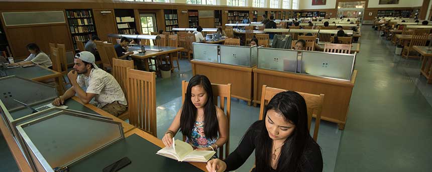 library reading room with students studying