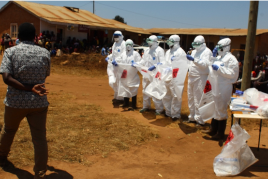 Health professionals donning proper personal protective equipment
