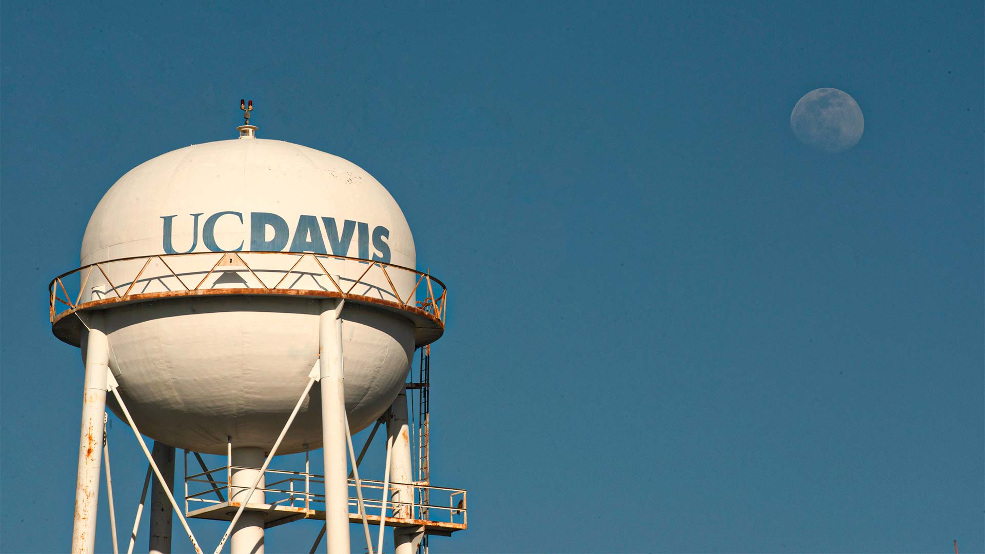 UC Davis water tower with moon