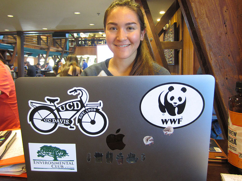 Emma Reinhardt poses with her laptop