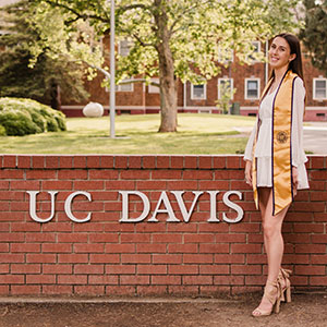 Josephine Thornton at the UC Davis sign on Second Street