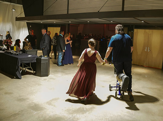 Kooper Richardson, who recently had ankle surgery used a scooter to spare his foot for dancing with Montana Klentz, 17.