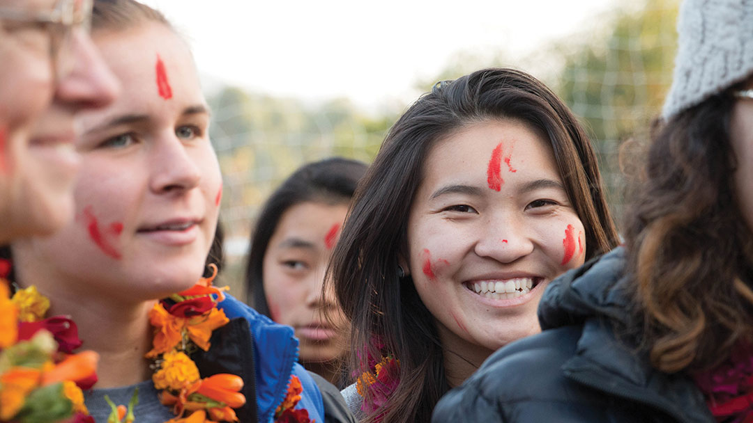 College students in Nepal with facepaint