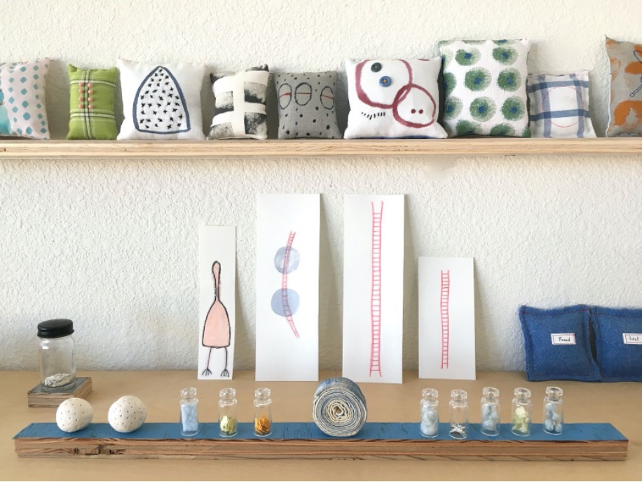A shelf of art objects