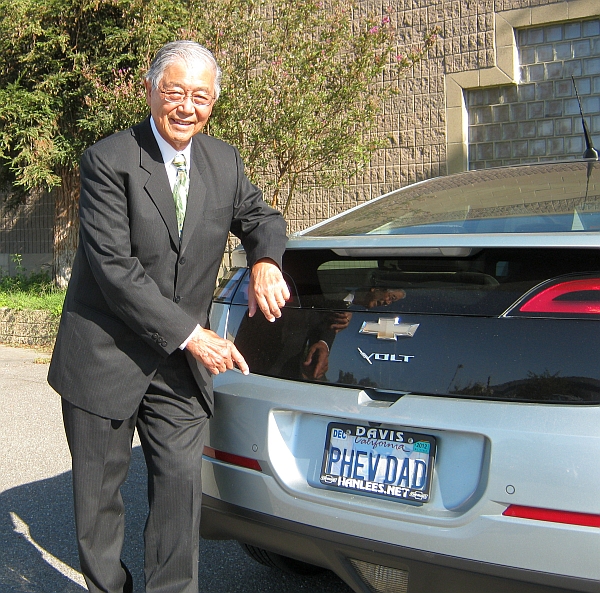 Professor Andrew Frank with his plug-in hybrid car. Its license plate reads PHEVDAD.