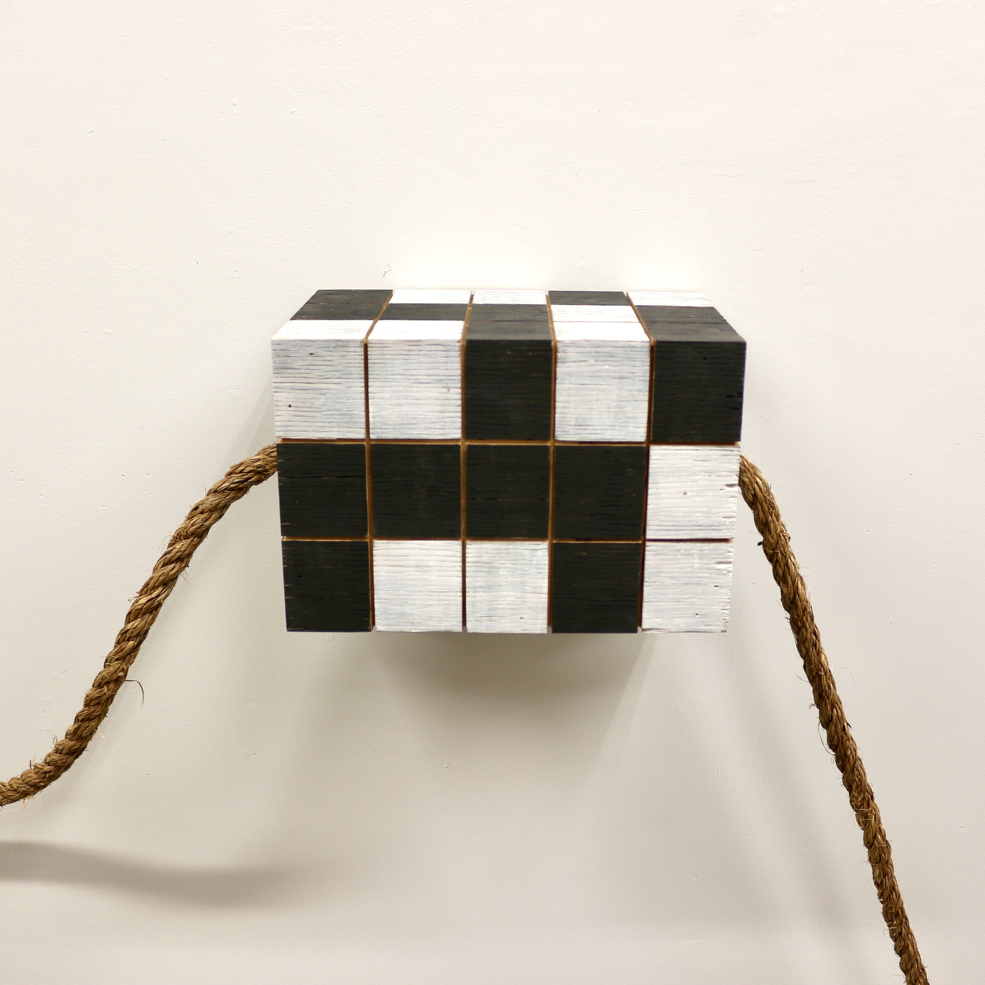 Sculpture in black and white that looks like a Rubic's Cube