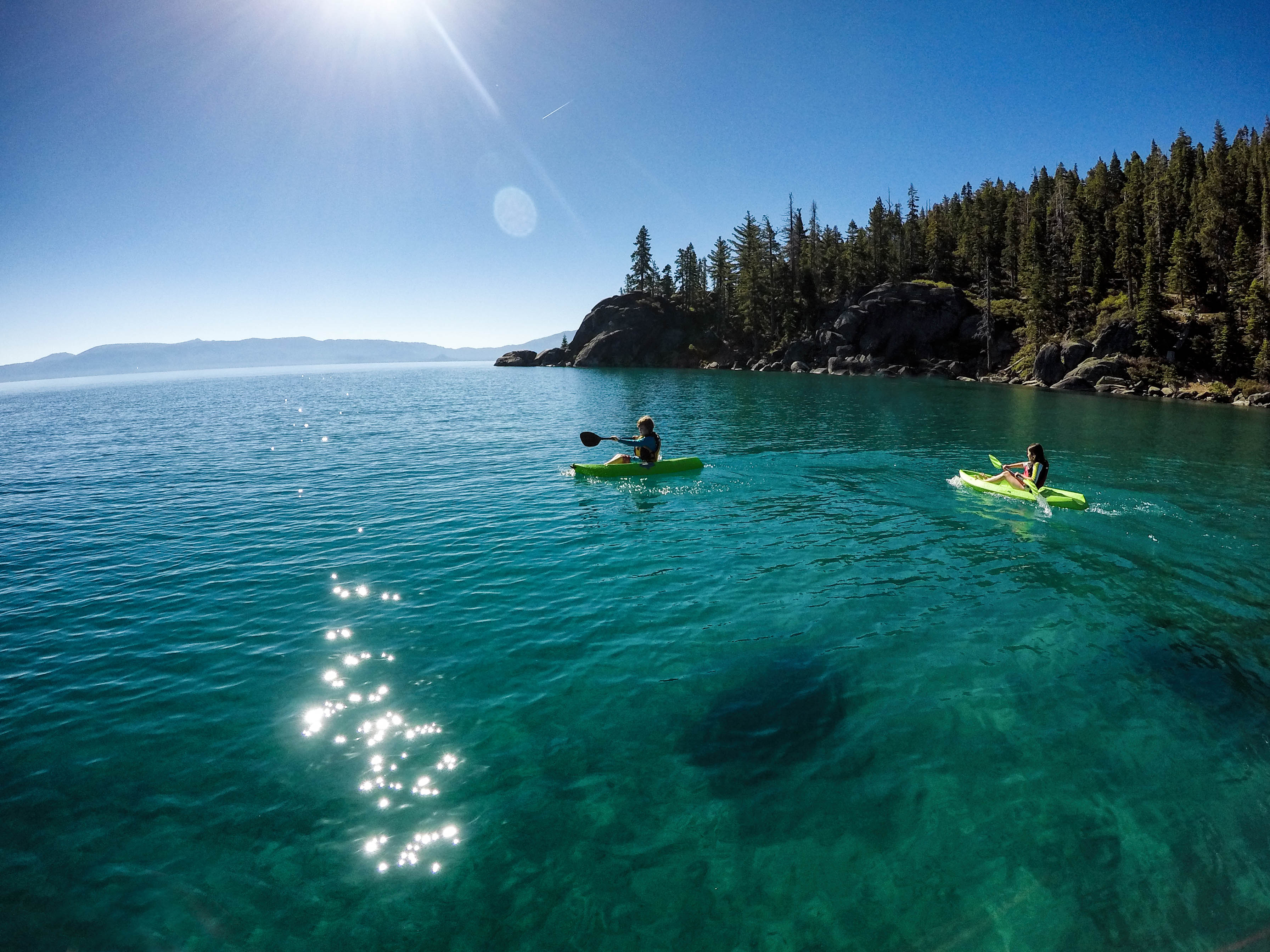 two kayakers paddle in Lake Tahoe 