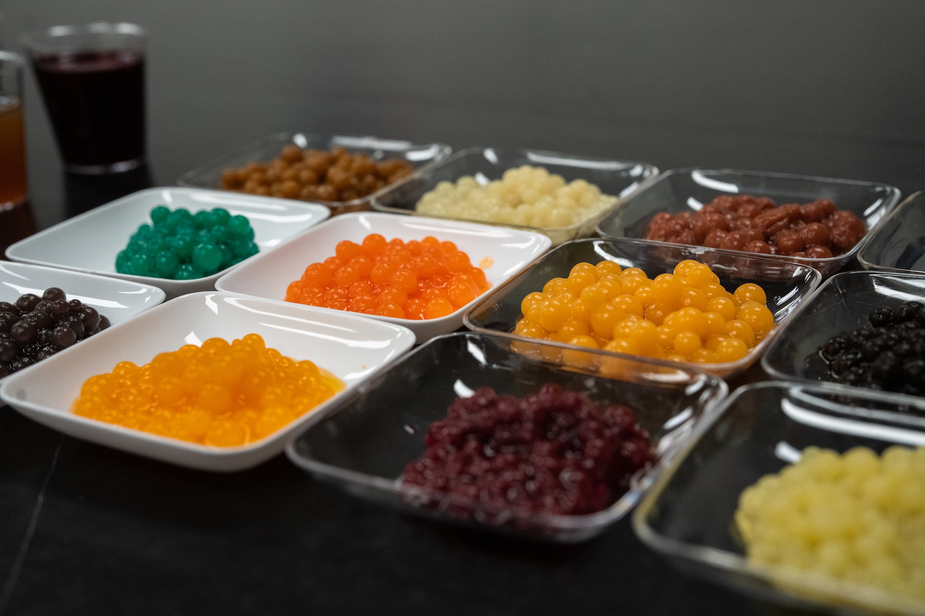 UC Davis researchers have created a fungal based alternative protein that can be used as an ingredient in all kinds of food products. The spherical pellets of orange, green, brown and purple shown here could be used as a replacement for tapioca balls in boba tea. (Jael Mackendorf /UC Davis)