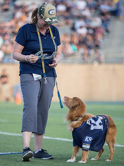 Danika Bannasch with Pint on the football field.