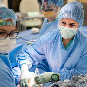 A doctor operates on a patient in the or