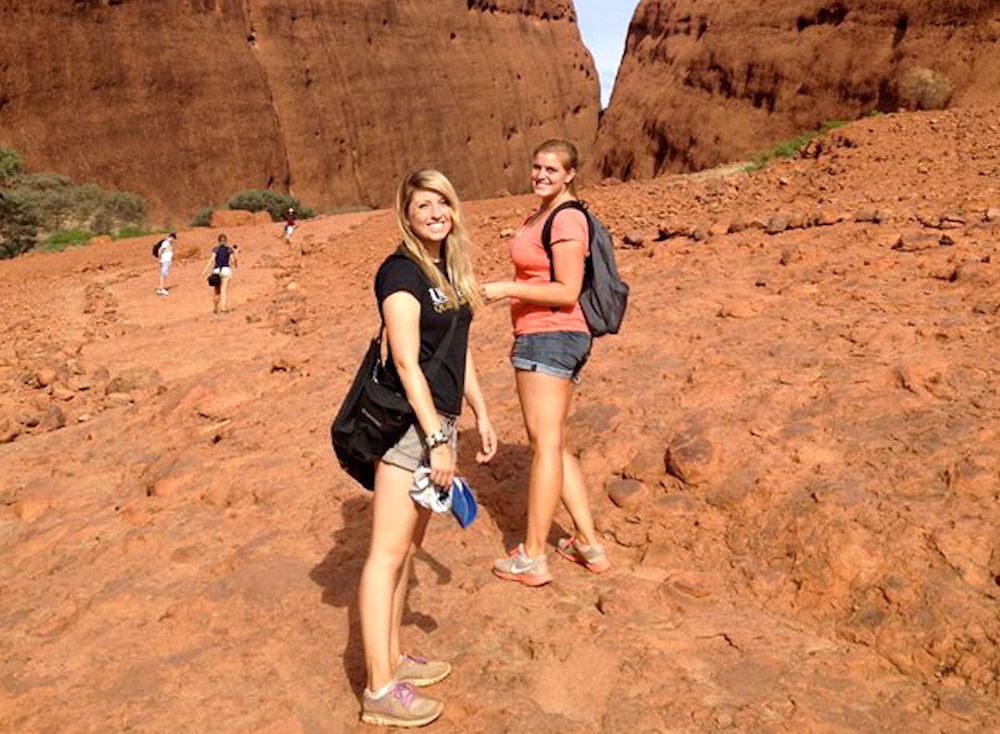 Two students pose in front of mountains in Australia as part of the professional writing minor.
