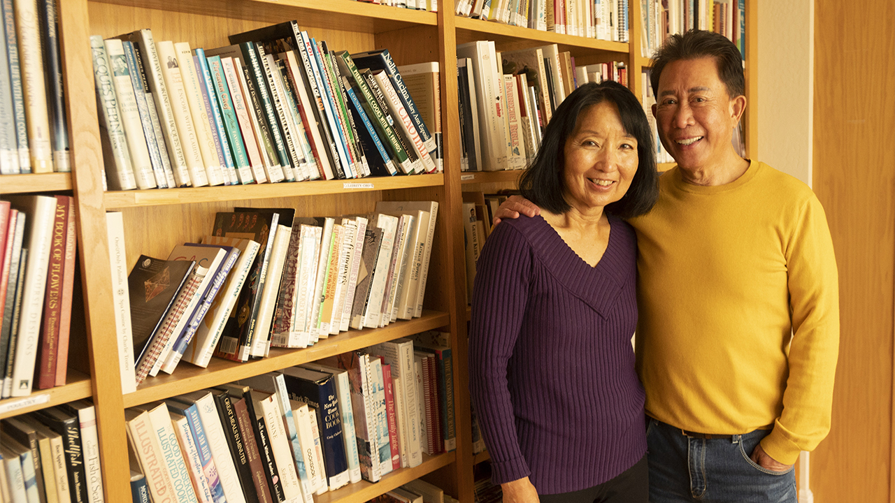 Martin and Susan Yan with some of the chef's cookbooks