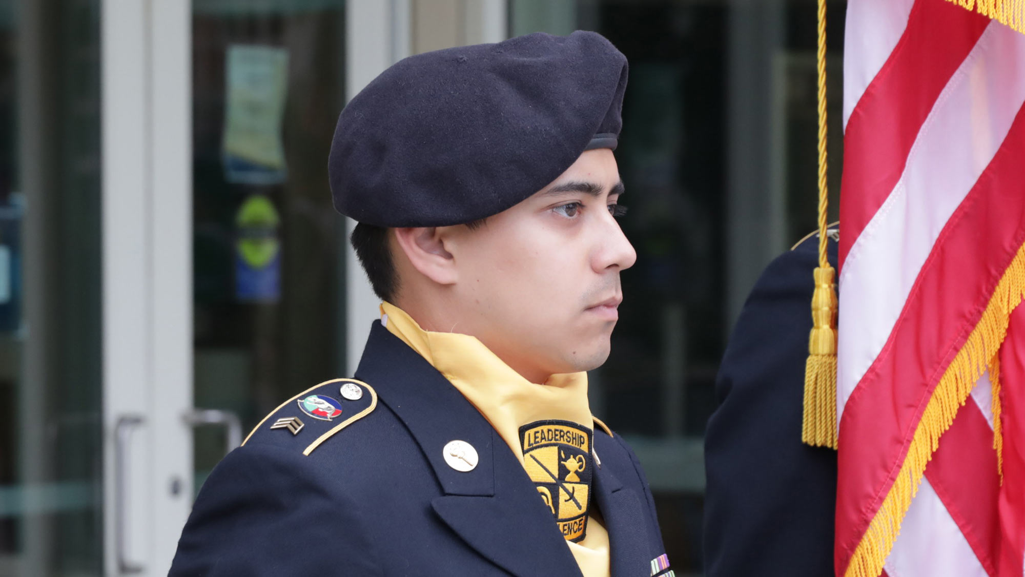 Army ROTC cadet, as part of color guard, at attention