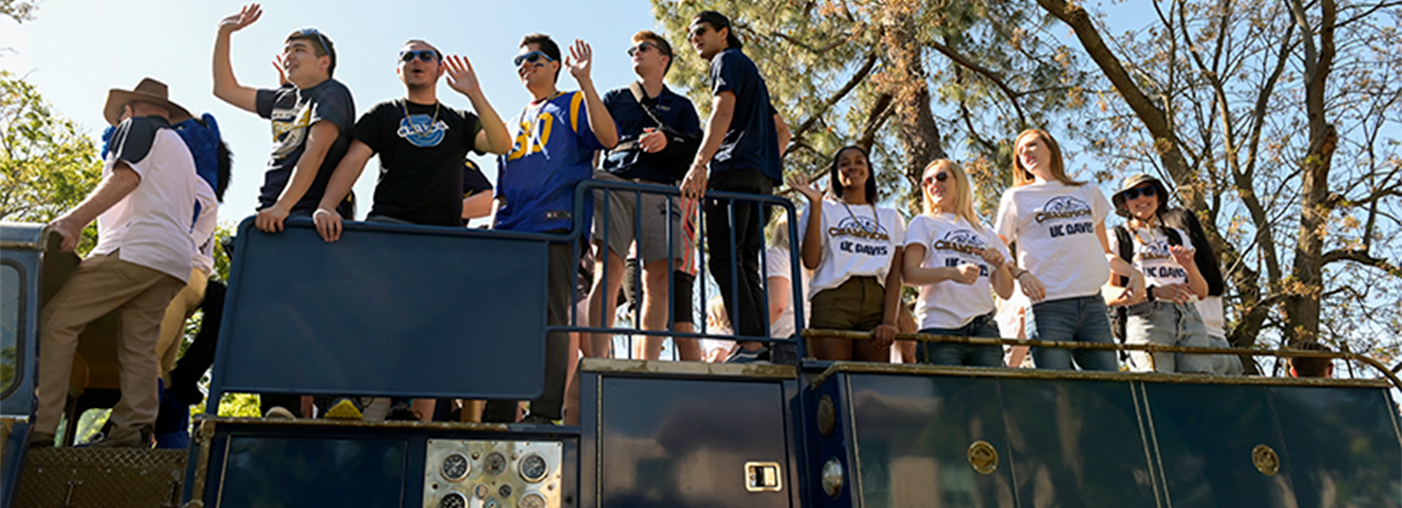 Students wave from atop a fire truck during Picnic Day parade