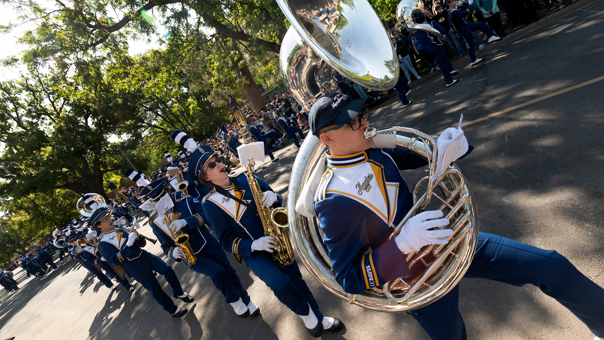 Marching band members participate in the Picnic Day parade.