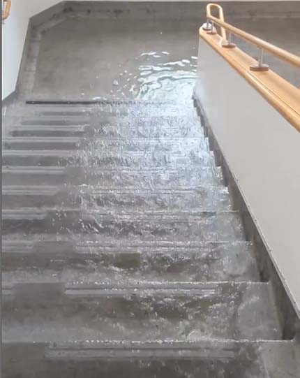Water runs down stairs