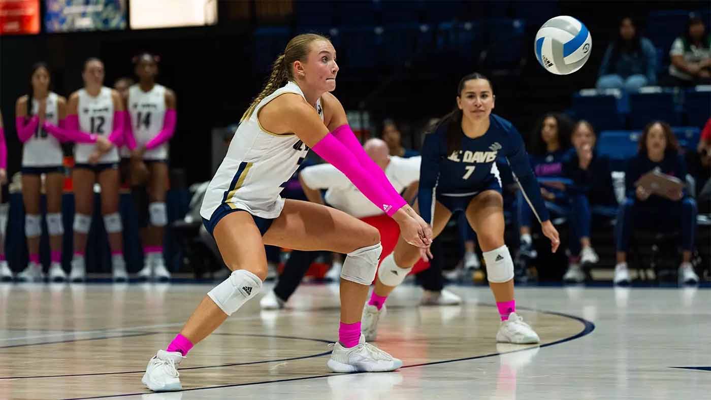 Volleyball player prepares to hit ball