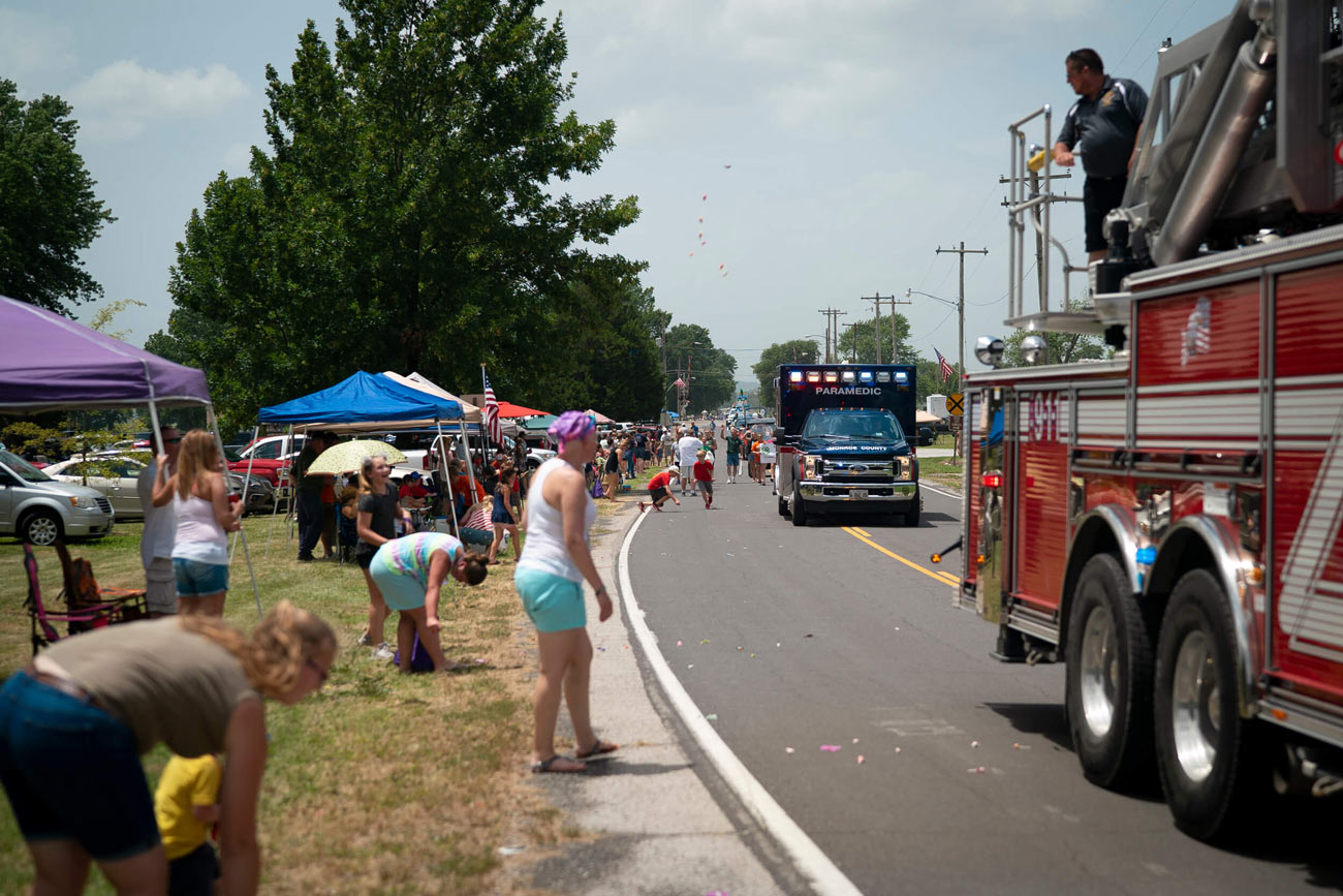 parade with people and trucks