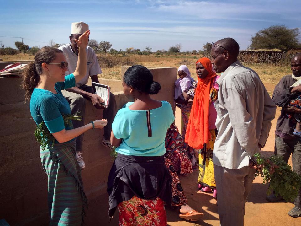 Carrie Waterman talks with Tanzanian community members