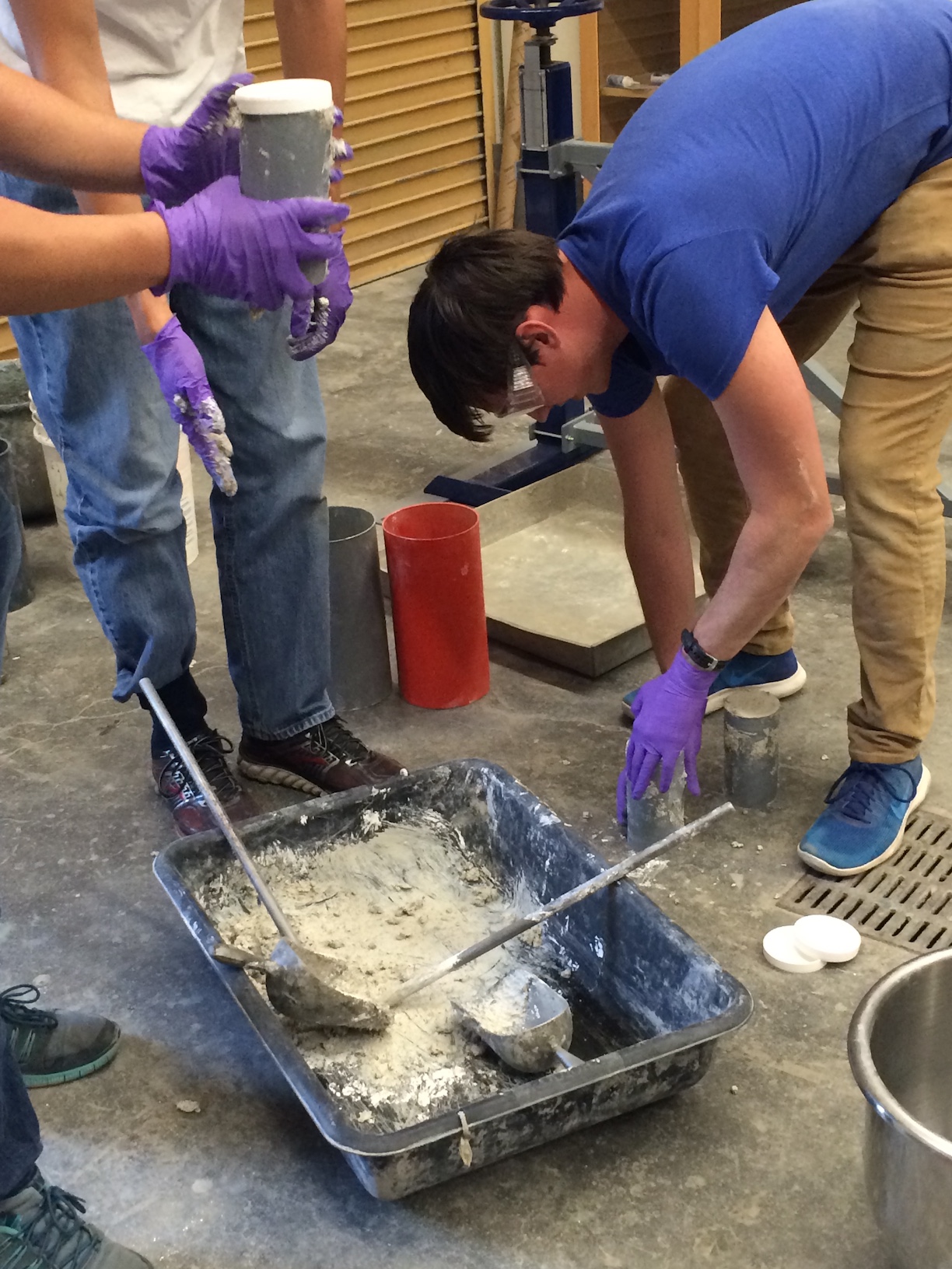 students batch concrete as part of class