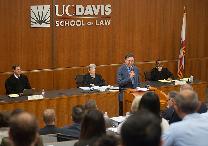 Dean Kevin Johnson speaking before an appellate court hearing at the UC Davis School of Law.