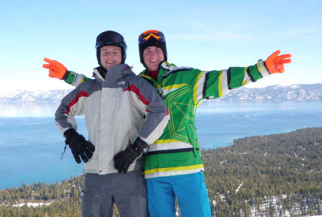 Two skiers atop mountain