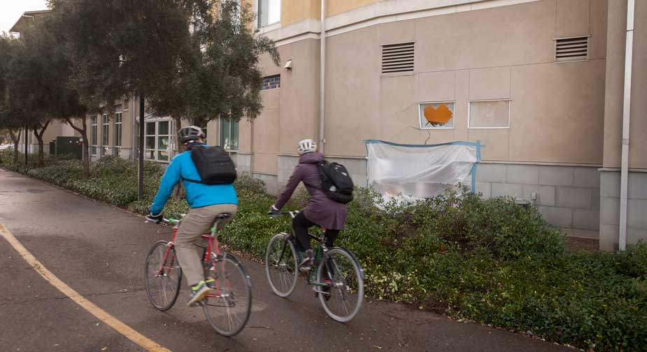 Temporary covering over hole in wall of residence hall.