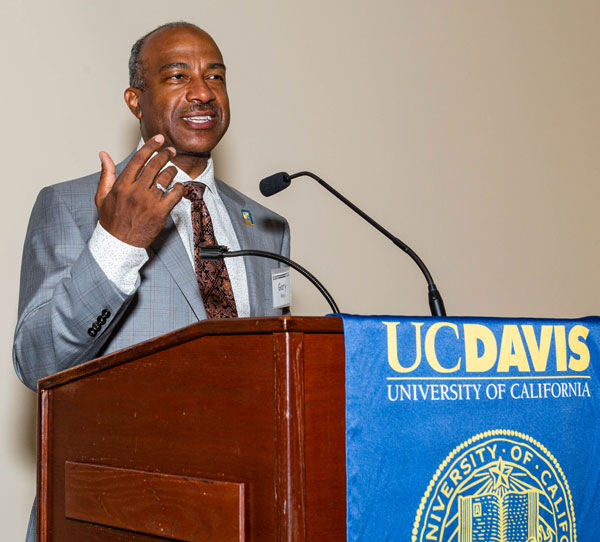 Chancellor Gary S. May, at podium, gesturing with hand.