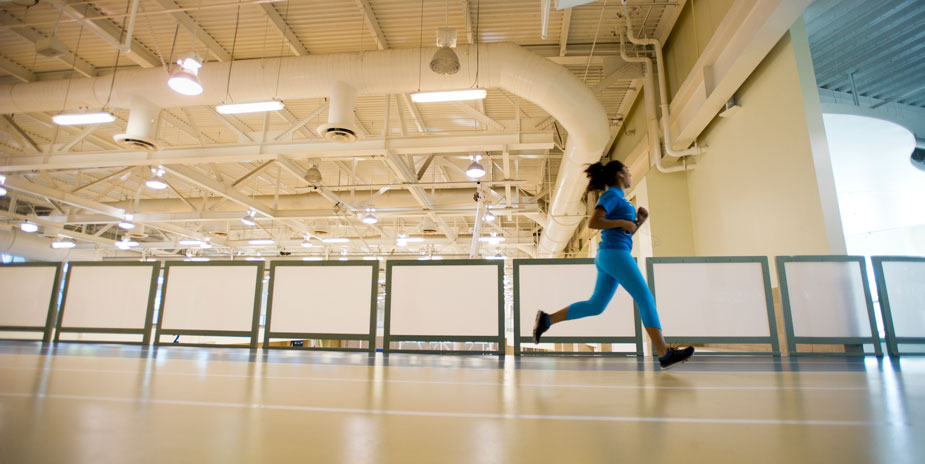 Woman on indoor track at the ARC