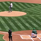 Jake Maier throwing out the first pitch at an Oakland A's game.