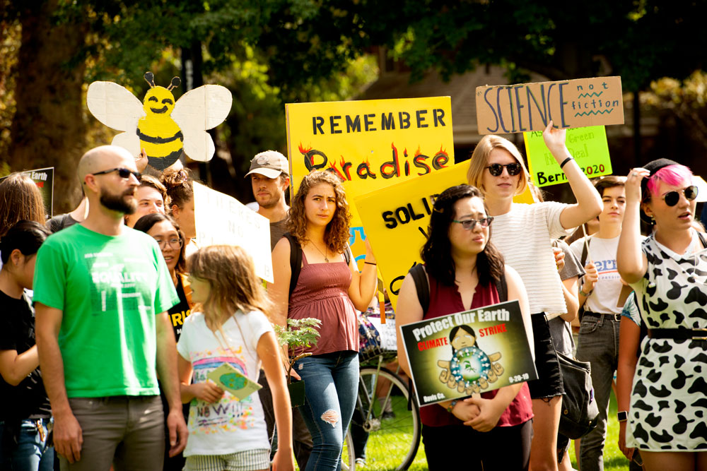 Climate strikers include one with a bee headdress.