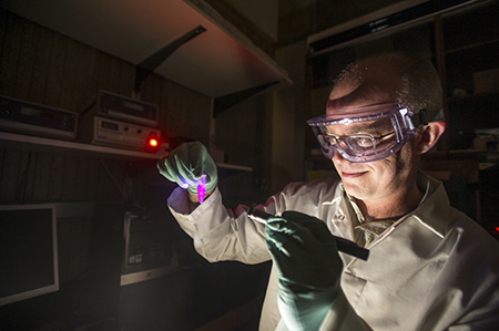 A male scientist works in a lab