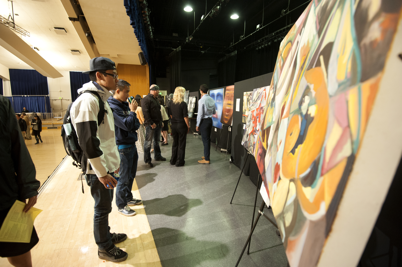 Students look at artwork