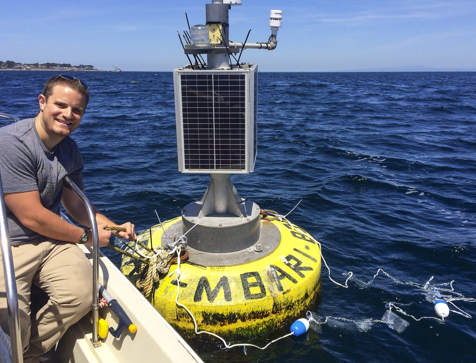 Scientist at research buoy