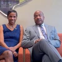 Chancellor Gary May and LeShelle sitting in Walker Hall, the new graduate center