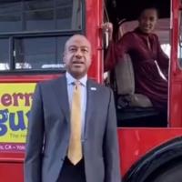 Chancellor Gary May and LeShelle in front of a classic double decker unitrans bus