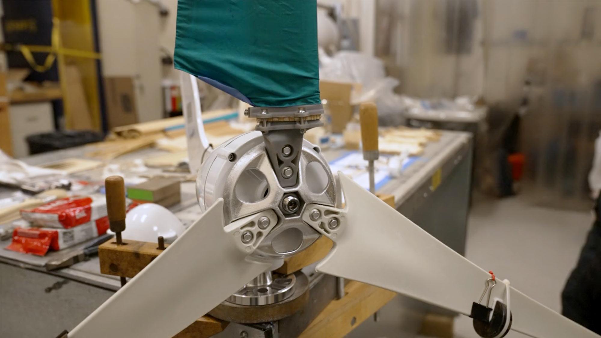A technician working on a compostible wind turbine