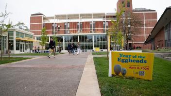 A yellow sign announcing the Year of the Eggheads in front of the Memorial Union.