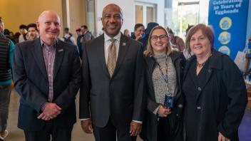 Karl Engelbach, Gary May, Lori Hubbard, and Tammy Heath smile happily at the camera during the Year of the Eggheads VIP celebration.