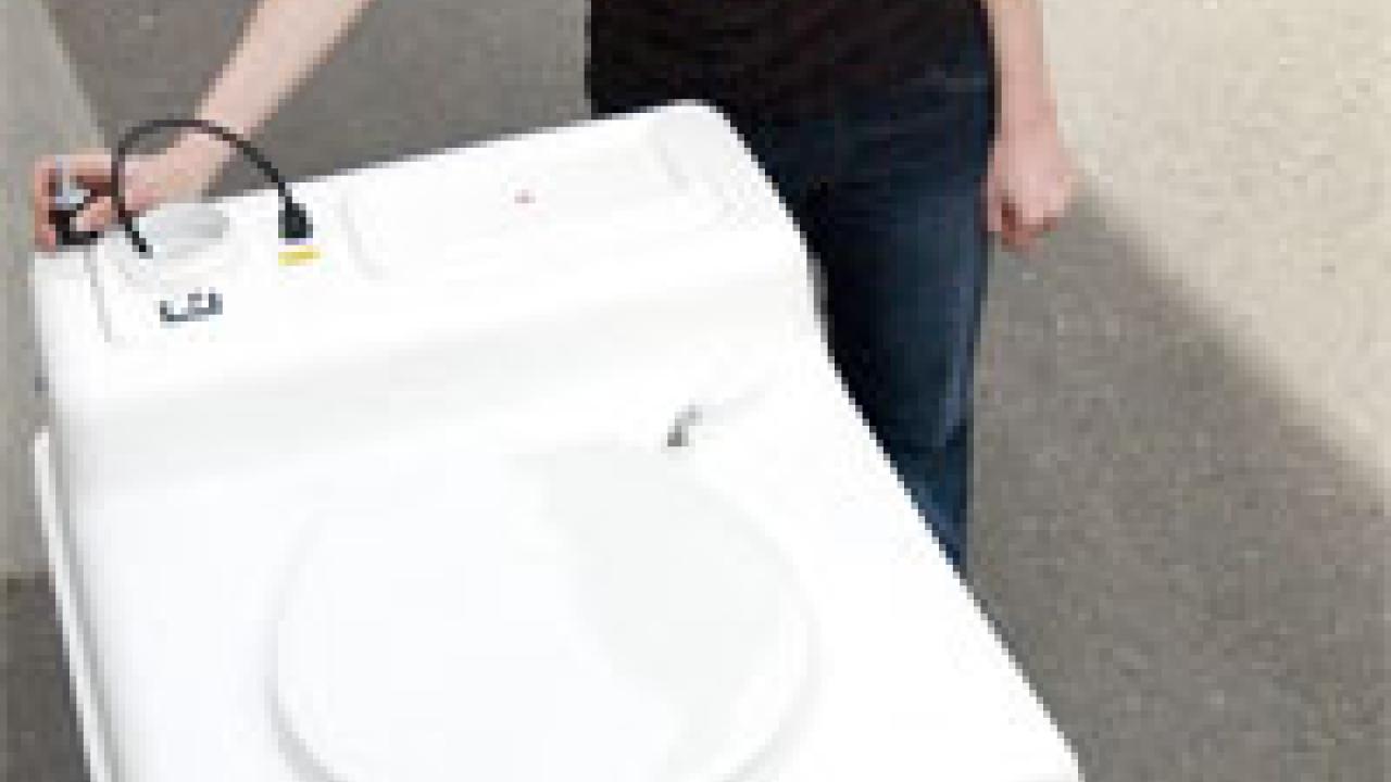 photo: woman with square boxed toilet
