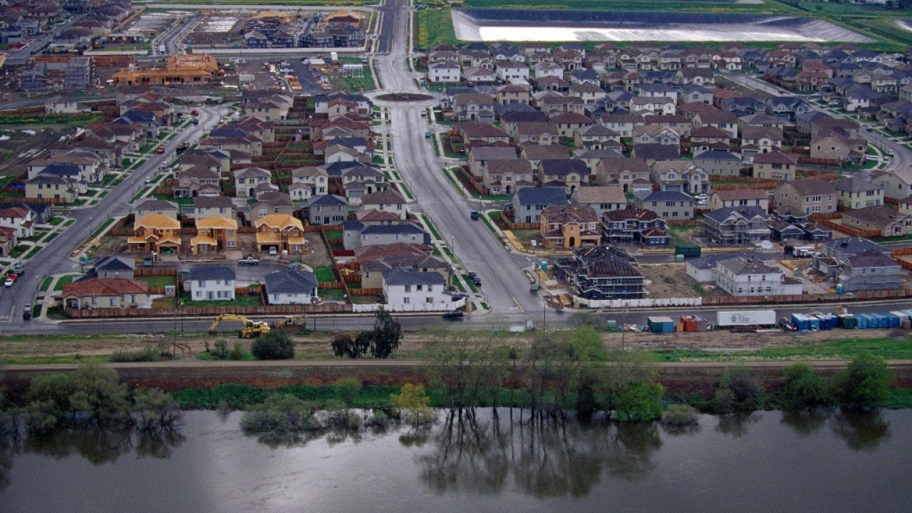 Homes behind a levee in Stockton, California.