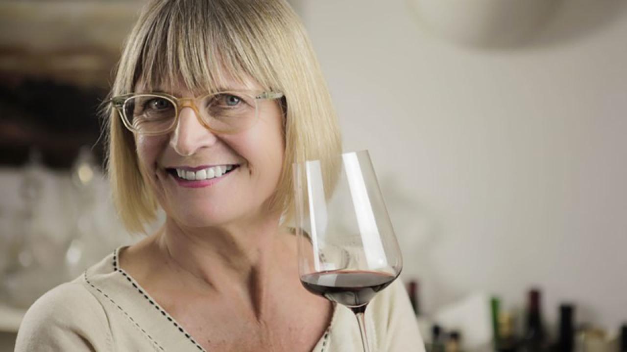 Jancis Robinson holds a glass of wine