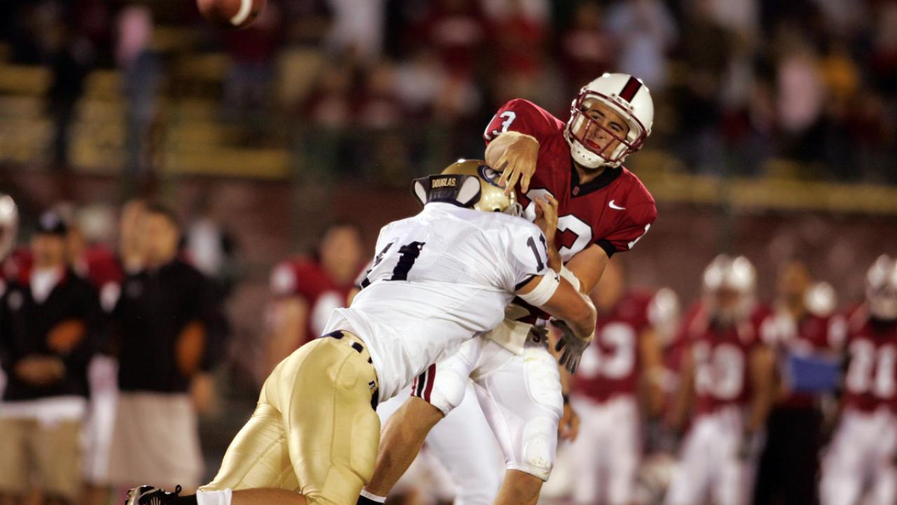 UC Davis football player tackles quarterback.
