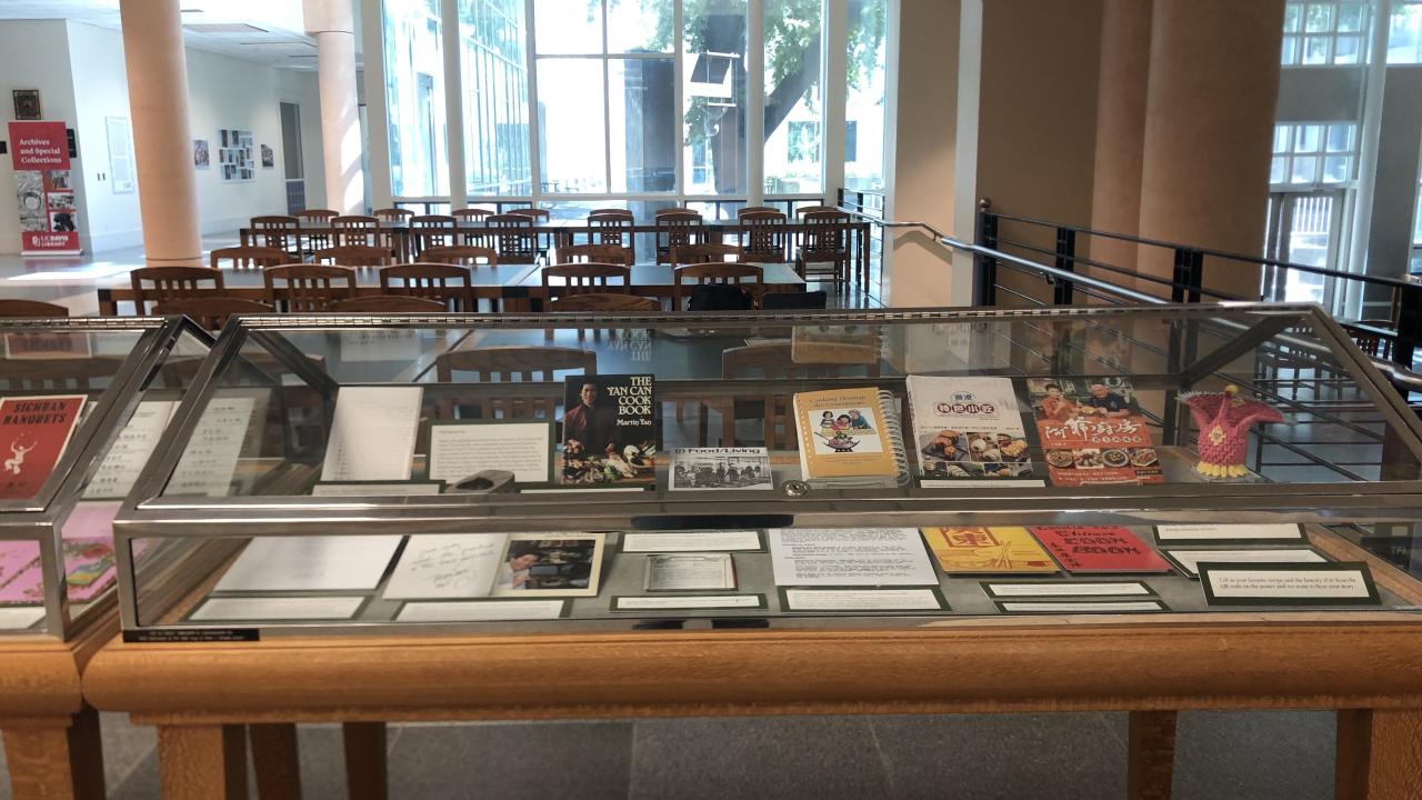 Display case of Chinese cookbooks and menu items