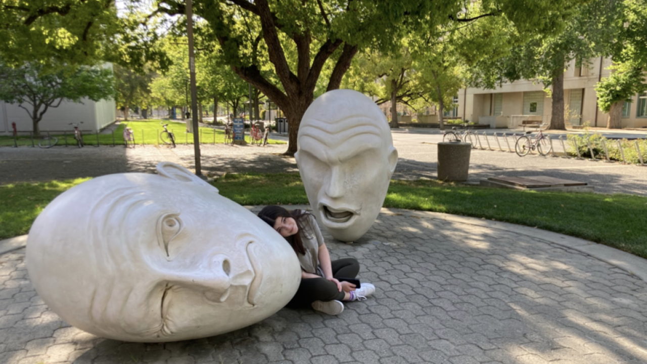 girl in front of two eggheads