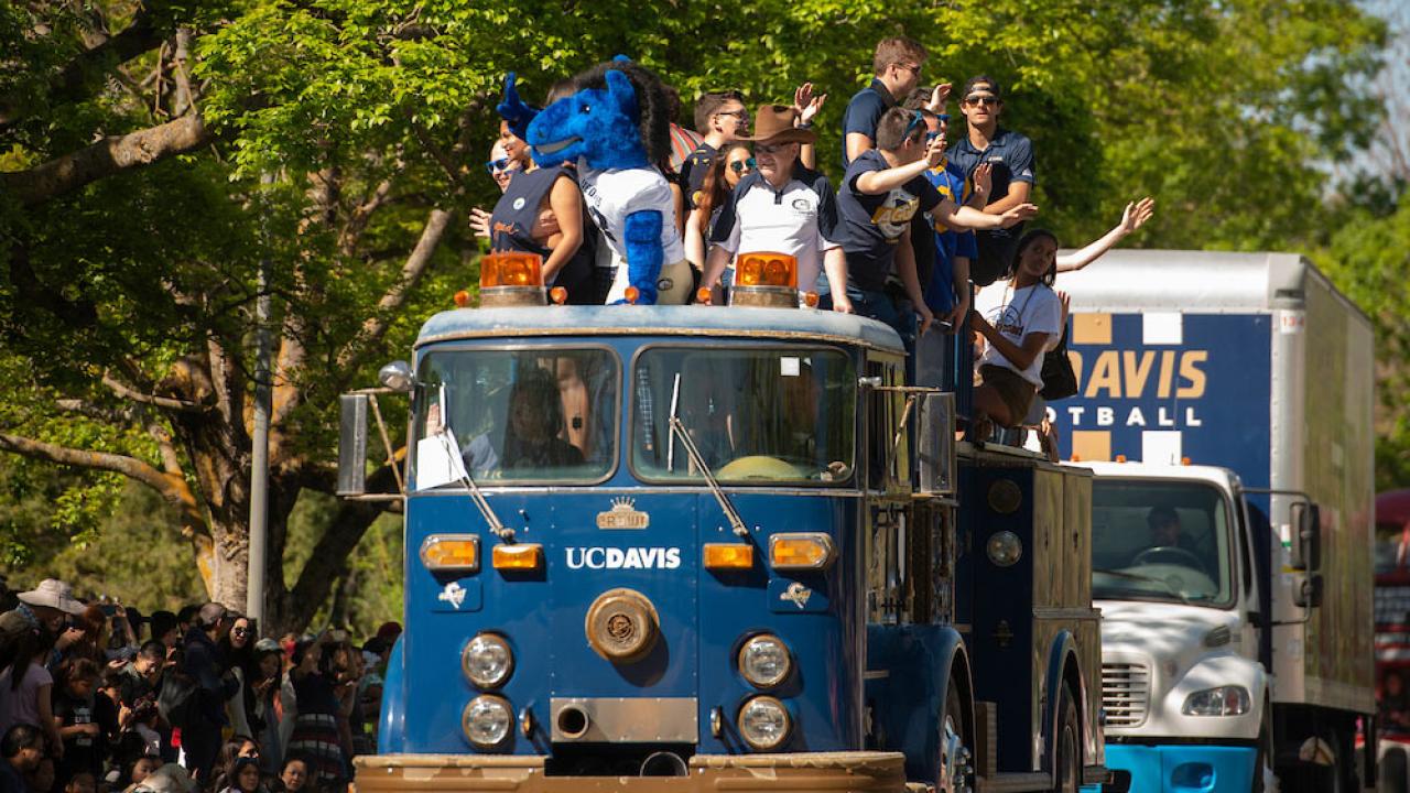 Student ride on a custom made "UC Davis" fire engine in the annual Picnic Day parade 