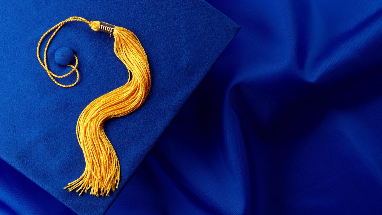 Graduation cap and tassel, blue and gold