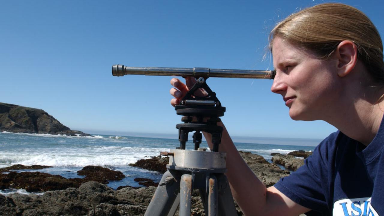 A female student surveys the shoreline near Bodega Bay